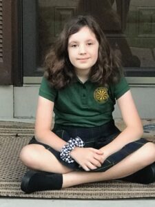 Catholic school girl sitting